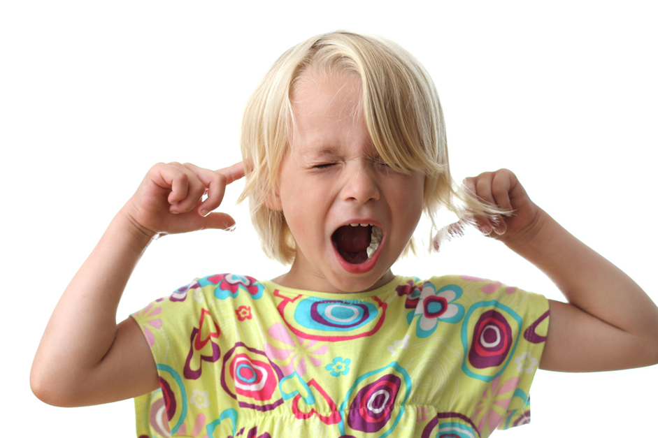 Child holding head and screaming, which might be a sign the child needs ABA therapy.