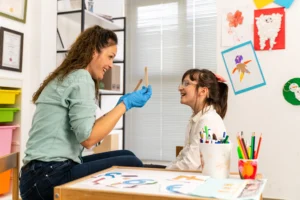 RBT working with child. Becoming an RBT lets you make a difference in children’s lives.